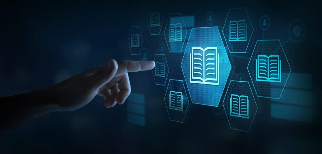 A closeup of a hand with a finger outstretched, reaching for a holographic icon of an open book.